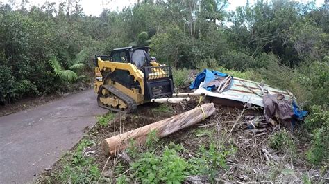 How to Move Logs with a Skid Steer Cat 259D 